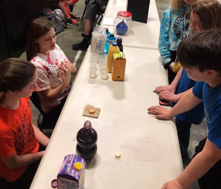 Students presenting to younger students.